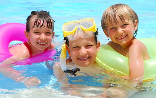 a group of kids in a pool