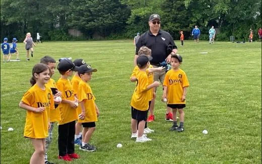 a person talking to a group of kids