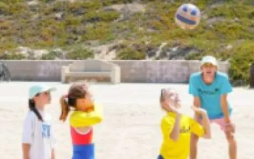 a group of kids playing with a ball