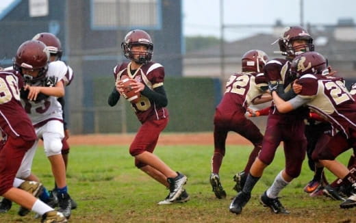 a group of people playing football