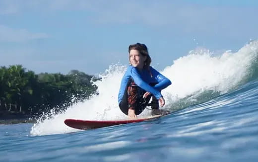 a man riding a surfboard