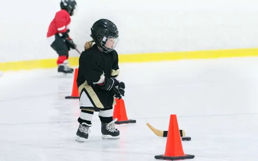 a young girl playing hockey