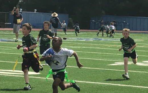 a group of boys playing rugby