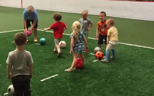 a group of kids playing football