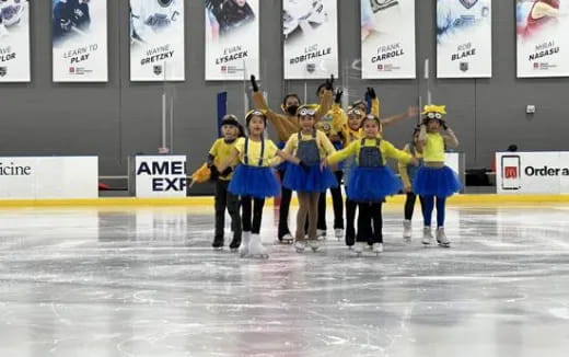 a group of women in a line on ice