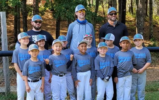 a group of people wearing baseball uniforms