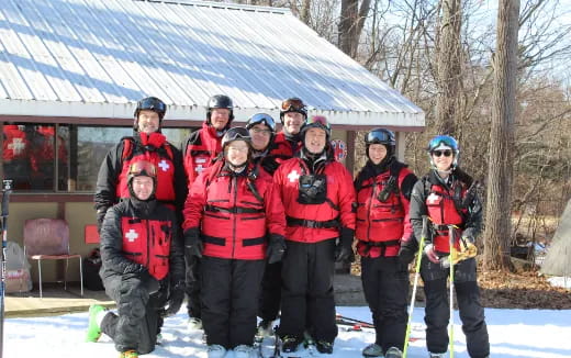 a group of people in ski gear posing for a photo
