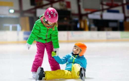 a person and a child ice skating