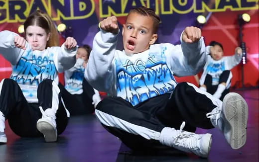 a group of kids in a dance pose