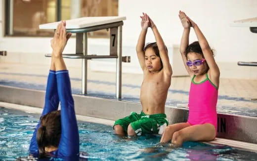 a group of people in a pool