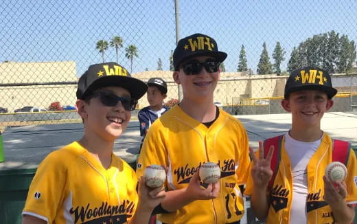 a group of boys wearing baseball uniforms