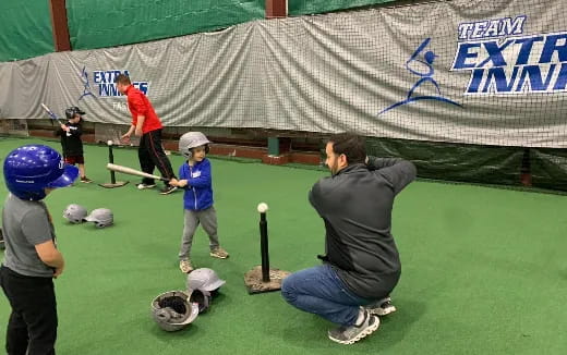 a person hitting a ball with a bat