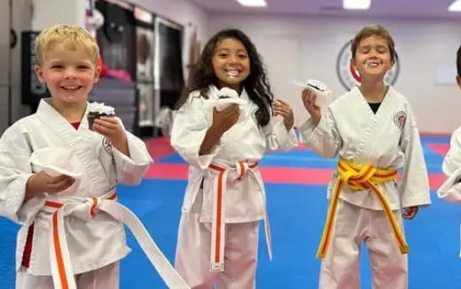 a group of women in karate uniforms