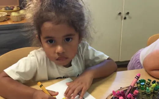 a child sitting at a table