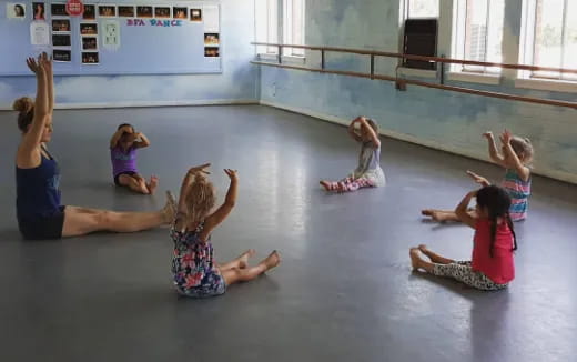 a group of children doing yoga