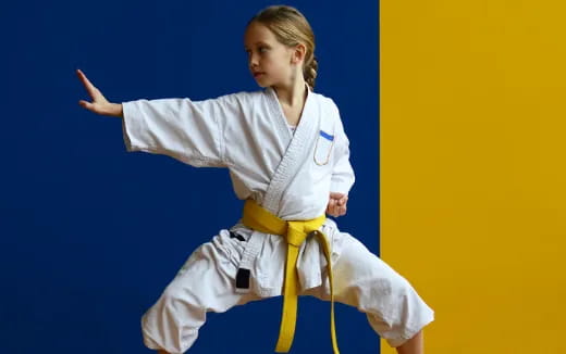 a man in a karate uniform