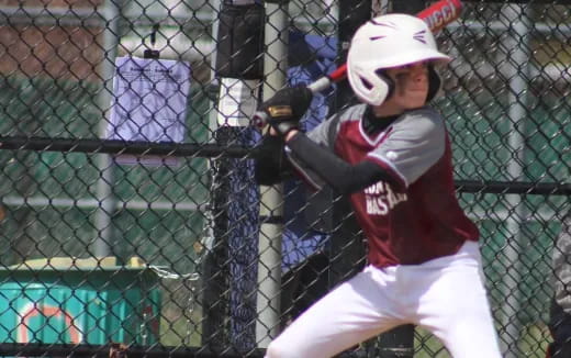 a young boy playing baseball