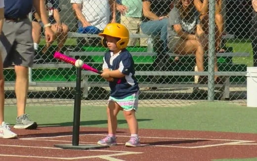 a little boy playing baseball