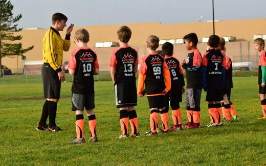 a group of boys in football uniforms