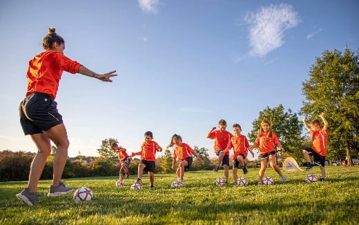 a group of kids playing football