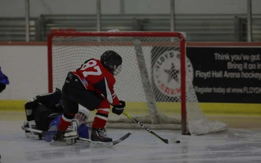 a hockey player in a red uniform