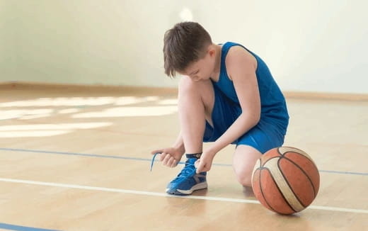 a boy playing basketball