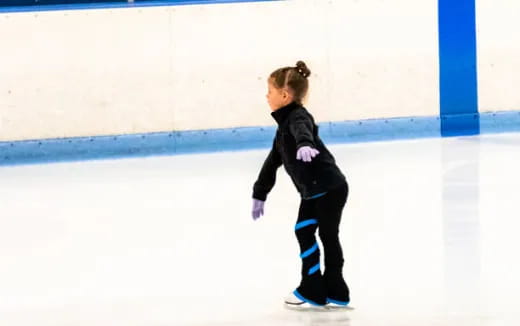 a young girl ice skating