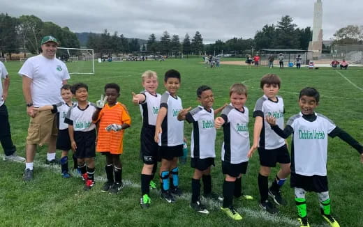 a group of kids in football uniforms