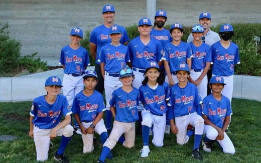 a group of kids in blue uniforms