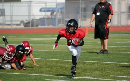 a football player running with the ball