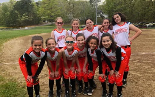 a group of people wearing sports uniforms