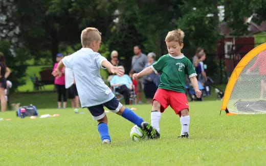 kids playing football on a field