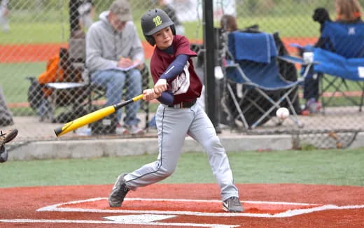 a baseball player swinging a bat