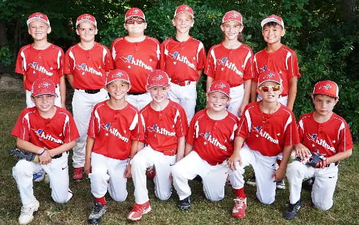 a group of people wearing matching red and white uniforms