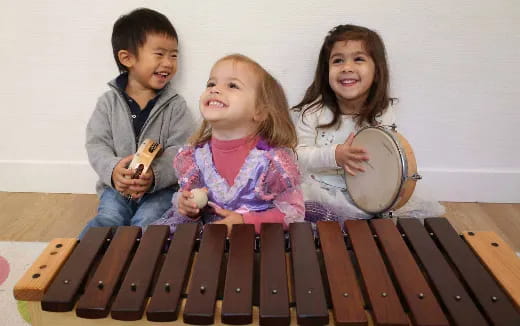 a group of kids playing instruments