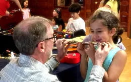 a man and a girl playing with a toy