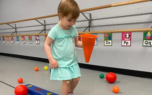 a child playing with balls