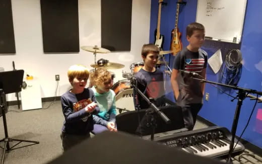 a group of kids playing instruments