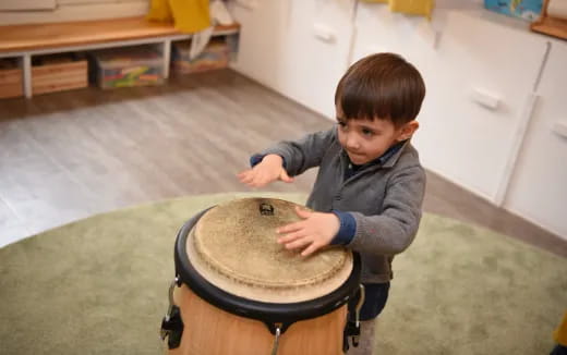 a child playing a drum