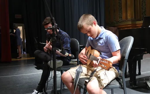 a man playing a guitar