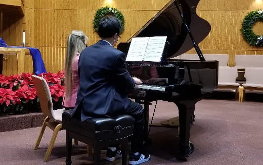 a person playing a piano