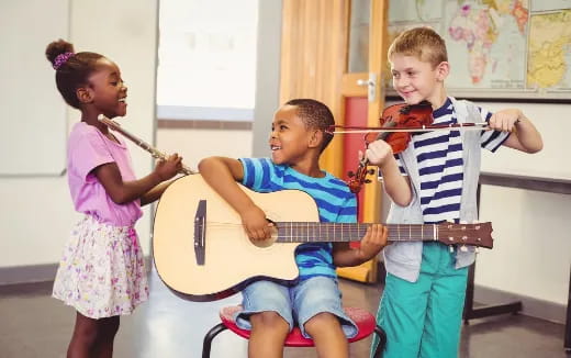 a group of children playing a violin