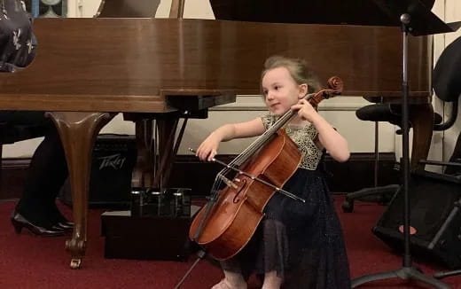 a girl playing a cello