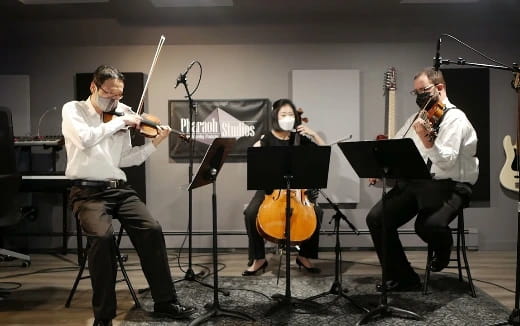 a group of people playing instruments