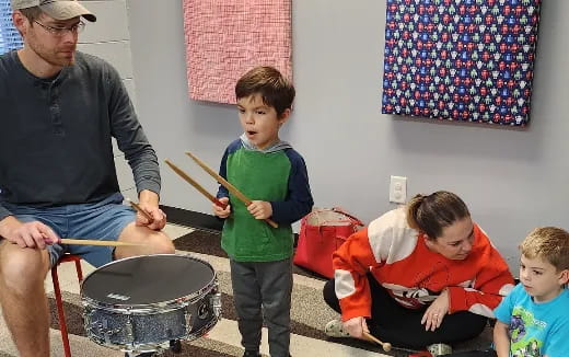 a group of people playing drums