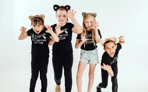 a group of kids posing for a picture