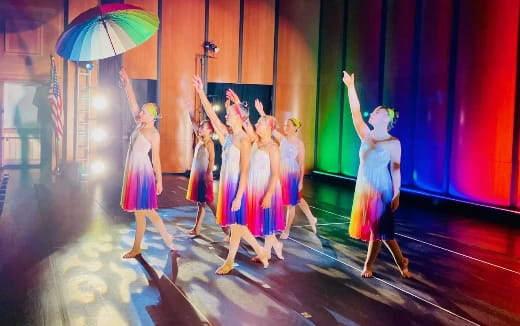 a group of women dancing on a stage