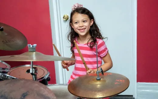a girl playing drums