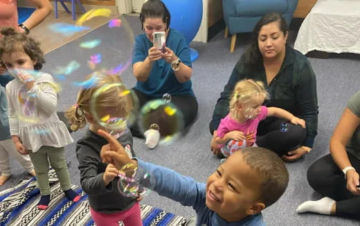 a group of children sitting on the floor