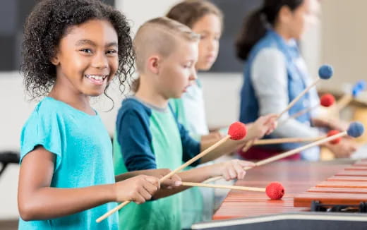 a few children playing pool